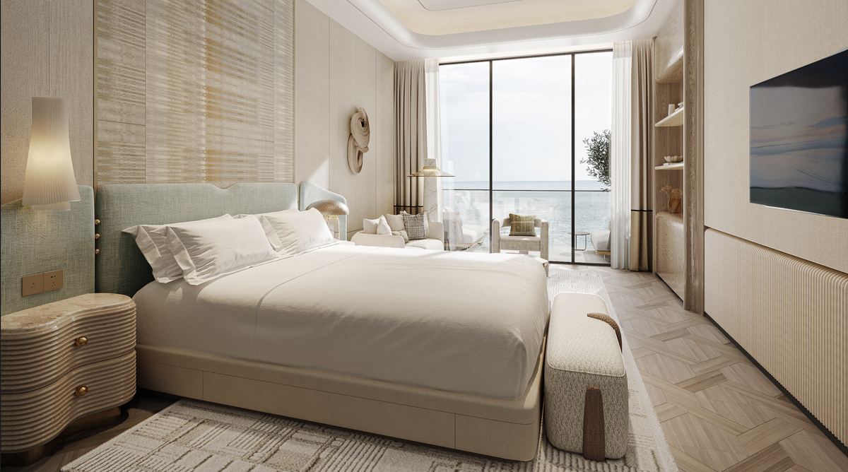 Bedroom with sea-view balcony at Nasim Al Bahr Residences